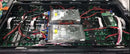 Two silver metal power supply units with fans inside a black gilbert engineering usa commercial grade cabinet