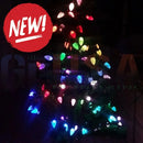 A festive christmas tree lit with colorful red green blue and yellow led lights using 12v replica c7 pixels pixastring by mattos designs