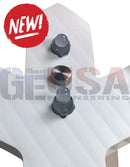 Three black and copper ezmount steel pixel mounts with clear domed tops on a white ribbed surface for any surface use