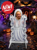 White ghost-shaped interactive photo prop with smiling child cutout flowing fabric and two stand brackets for photo ops