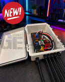 White plastic outdoor electrical junction box open showing wiring and circuit board for quin-led-dig-quad runs wled and schedule support