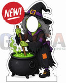 A black witch with gray hair and a purple hat stands by a green bubbling cauldron holding a wooden stirrer in interactive photo op props