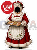 Red and white christmas-themed interactive photo op props cutout of woman in apron holding tray with cookies
