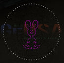 A purple led hattitude quartet spinner singing light forming a glowing bunny silhouette with white dots by gilbert engineering usa