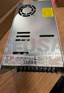 Meanwell lrs-600-12 silver metallic dc switching power supply with black vents and yellow warning label for rgb pixels