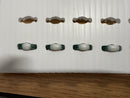 Green and white ceramic marbles with a glossy finish arranged on a white tray in matrix 4x8 mesh by gilbert engineering usa laser cut
