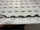 Green coiled wire with metallic connectors on white perforated surface for matrix 4x8 mesh by gilbert engineering usa laser cut