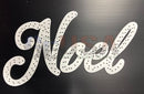 White perforated noel lettering cutout from impression with red snowflakes and canes n snowflakes design
