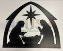 Black metal nativity cutout with star above manger in twinkly coro-tivity scene by gilbert engineering