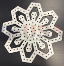 Flake g is a white snowflake shaped metal pegboard with laser cut holes by gilbert engineering usa for mini lights