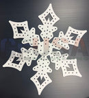 White snowflake shaped wooden craft piece with laser cut holes and cutouts by gilbert engineering usa node measures