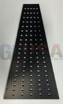 Black perforated flat tree panels made by gilbert engineering usa with laser cut holes and vertical ridges