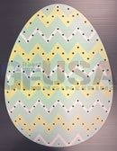Pastel-colored impression easter eggs pegboard with green zig zag and yellow and light pink egg shapes
