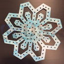 A laser cut impression flake wooden snowflake with distressed light blue and white paint by gilbert engineering usa