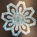 Impression flake g is a blue and white distressed metal snowflake wall decor with laser cut six-point design by gilbert engineering usa