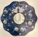 Blue and silver christmas wreath with laser cut stars bows and snowflakes by gilbert engineering usa on decorative surface