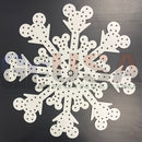 White snowflake magic flake with laser cut mickey mouse heads made from perforated material by gilbert engineering