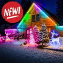 Rainbow-colored 12v replica c7 pixels double data pixastring led lights by mattos designs on snow-covered wooden house roofline and yard