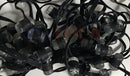 Black led string lights with clear cylindrical bulbs and black wiring from geusa’s black-out rgb pixels collection
