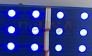 Blue led light panel from geusa’s black-out rgb with a central white and red striped vertical strip black-out rgb pixels