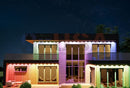 Modern two-story house with colorful led lighting accents using permanent holiday lighting 36v by gilbert engineering usa laser cut design
