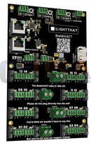 Black electronic circuit board with green connectors and white labeling branded i light that baldrick17 port controller geusa edition with power inputs