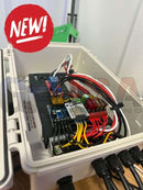 A white plastic enclosure with microcontroller relays and color-coded wiring for quin-led-dig-quad 12v 24v controller