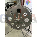Circular steel tree topper with sun design and cutouts in voodoo blue and emerald green colors