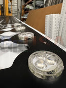 Clear circular led light modules with three bulbs each on a black base in matrix mesh for 30mm pucks by gilbert engineering usa