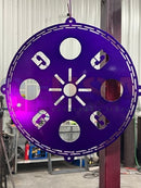 Purple metal circular steel tree topper with cut-out numbers and sunburst design, perfect for voodoo blue or emerald green decor