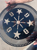 Black metal circular steel tree topper with cut-out stars number 9 and sunburst design perfect for voodoo blue or emerald green decor