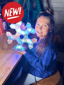 A glowing blue led snowflake light with hexagonal design and illuminated edges made from evo 12mm pixels waterproof