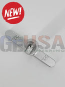 Silver metallic wing shaped latch with engraved m and geusa engineering branding on mattos designs pixel pushing jig set