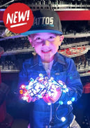 A child wearing a black and teal attos cap holds evo+ pixels 12v led pixels with glowing multicolored bulbs