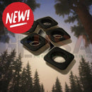 Black square camera lens caps with matte finish and central circular cutout for reinforcing megaTree pixel strips